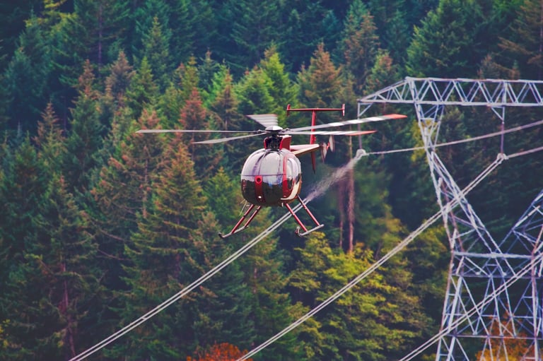 This helicopter is flying dangerously close the power lines.
